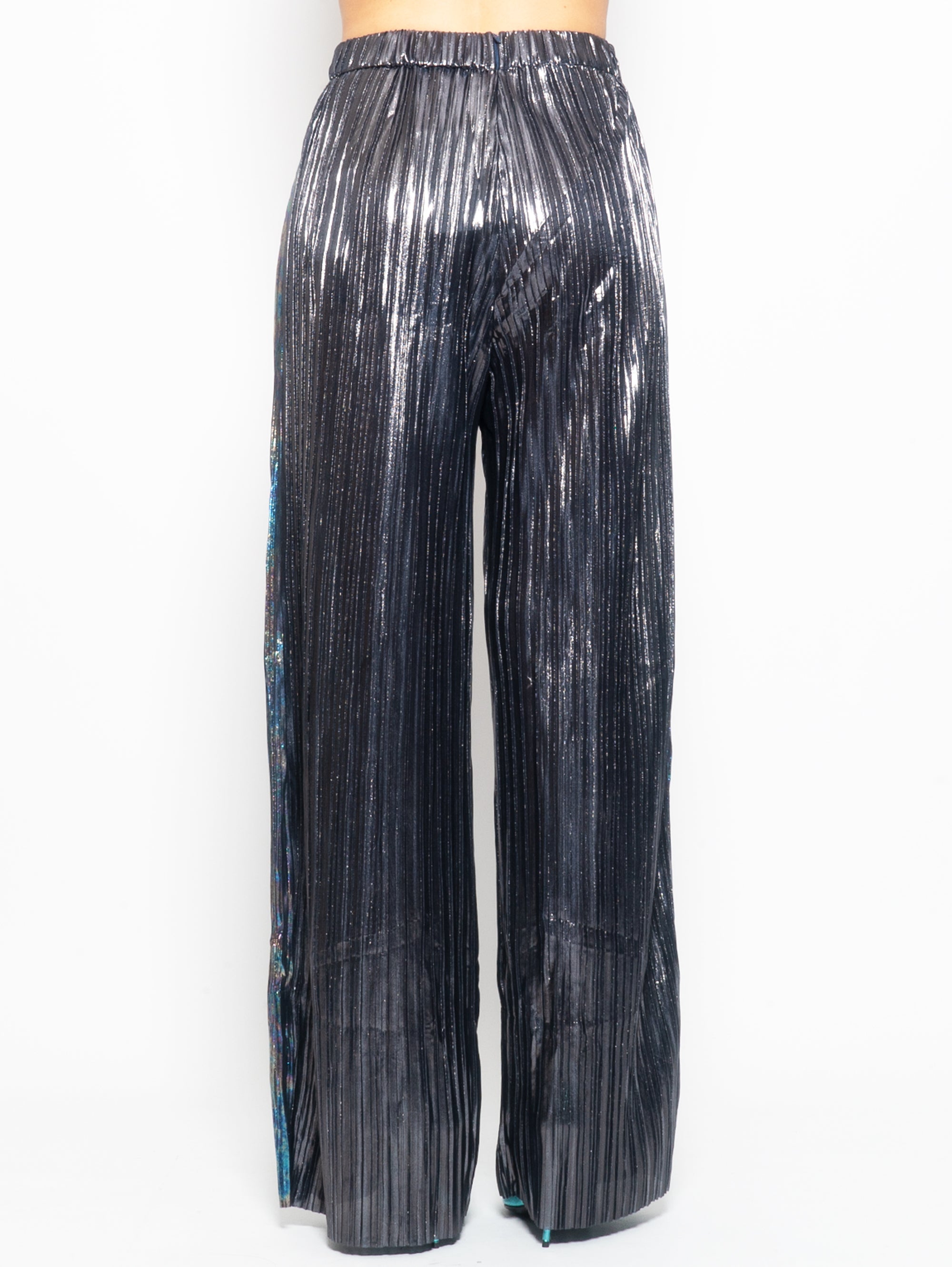 Trousers in burnished metal pleated laminate